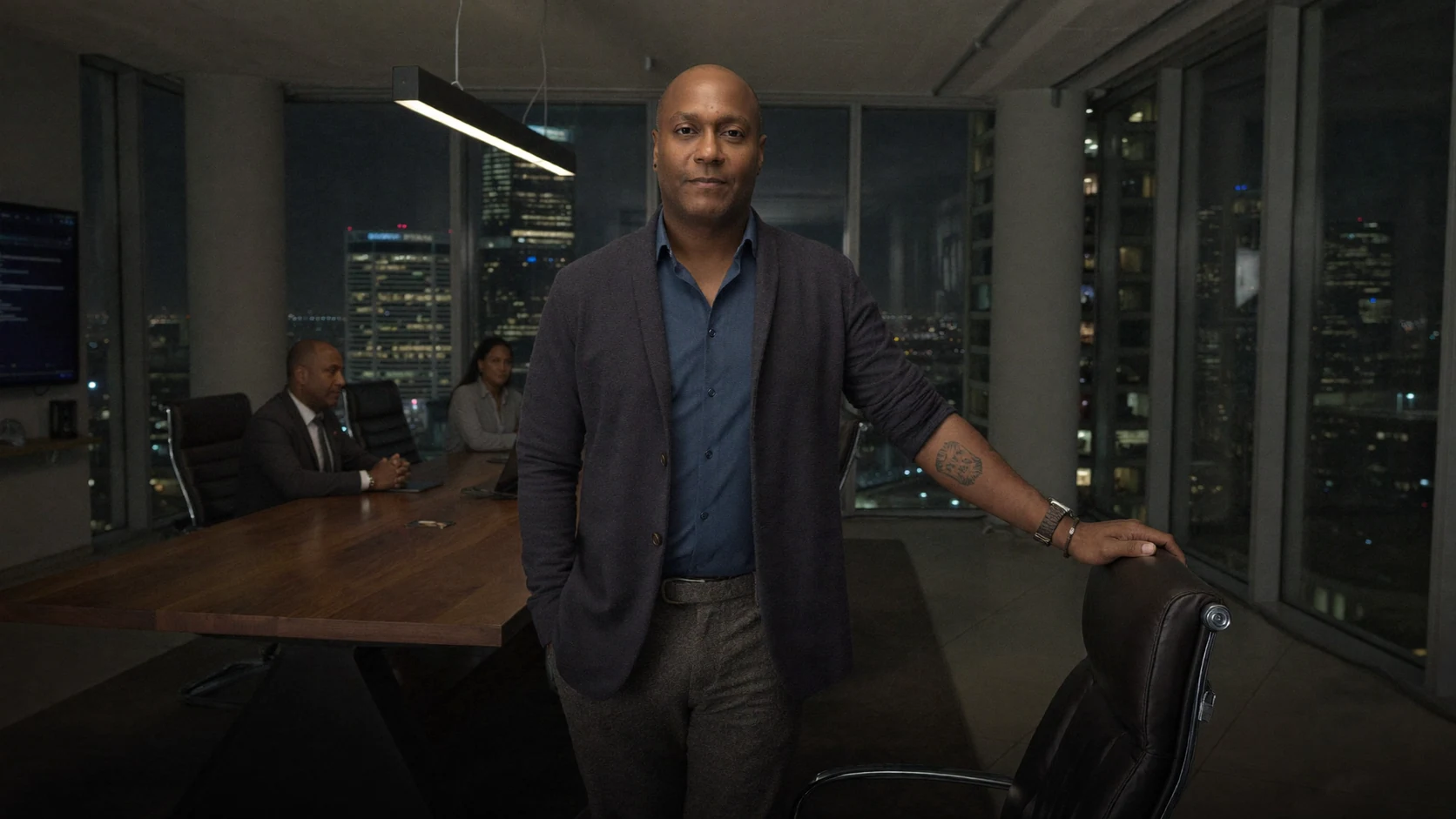 A composed executive leader in a nighttime boardroom